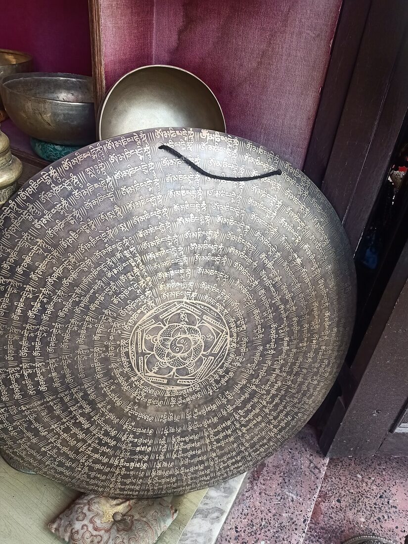 A large engraved brass gong in a metalworker's shop near Boudhanath